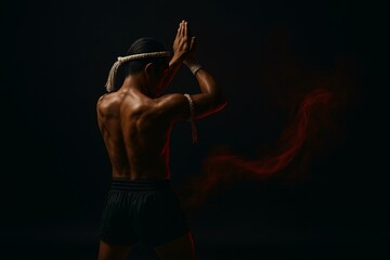 Muay Thai Warrior in Traditional Stance with Red Smoke Effect on a Dark Background