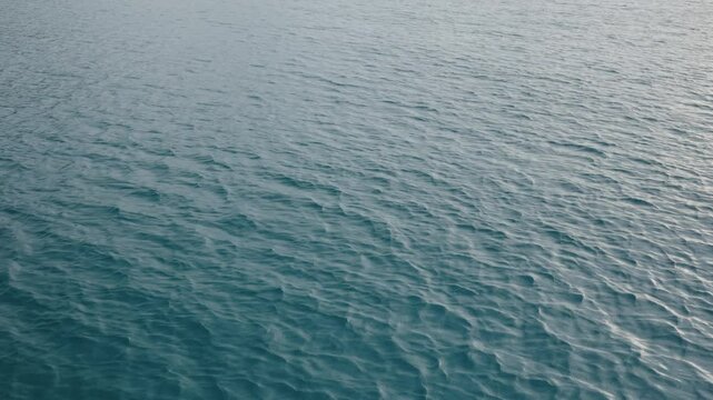 Slow motion closeup shot of ocean water surface