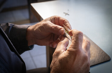 Hands ready the joint