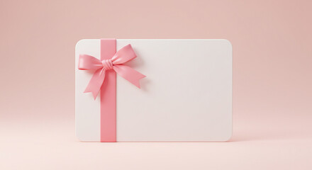 Delicate pink ribbon adorns a blank gift card, perfect for celebratory announcements or special occasions.