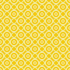 Seamless vector pattern with white polka dots on a sunny yellow background