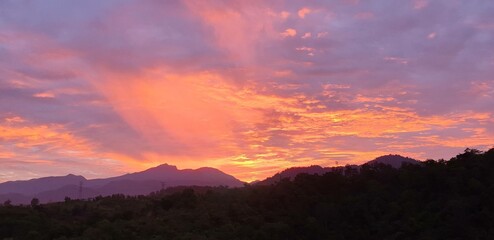 Serene Golden Sky During Sunrise Over Scenic Mountain Landscape