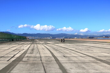 the empty runway at Gibraltar Airport with view to the sea