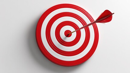 Arrow hitting bullseye on red and white target with a white background, close-up