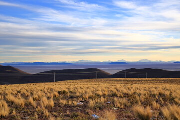 sunset view to the Salar de Uyuni Salt Flats in Bolivia from a viewpoint near the town Uyuni