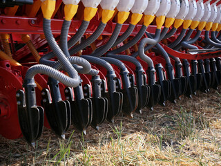 Close up of agricultural industrial equipment for sowing crops or fertilizers.