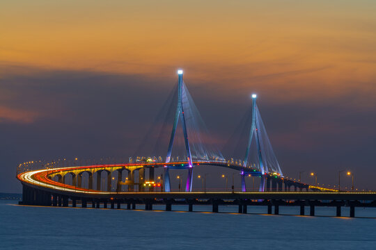 Incheon Bridge in the evening with colorful lights reflecting the beauty of the architecture in the middle of the water at Songdo-dong,Yeonsu-gu,Incheon,South Korea.