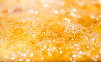 Close up bright orange Oil or beer splash texture and nature waves, Beautiful waves curve and...
