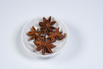 Star anise spice in white plate