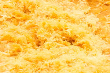 Yellow and orange peel background. Orange water with ripples on the surface. Defocus blurred...