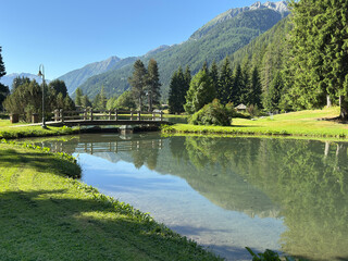 reflection in lake and mountains in gressoney italy