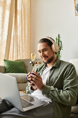 Young man enjoys a peaceful day at home while sipping coffee and listening to music