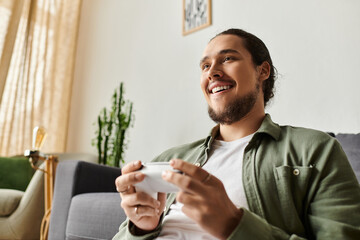 Gaming moments at home bring joy to a young handsome man enjoying his favorite pastime