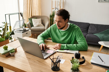 Young handsome man engaged in work from home session in a cozy living space