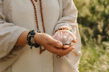 Close-up of female hands holding natural healing stones. Tools for energy balance, emotional support, self-discovery through intention, intuition, gentle presence. Vintage tone. Soft focus, blurred