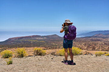 Fototapeta premium Hiker photographing La Fortaleza