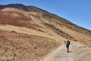 Woman shooting landscapes on Pico del Teide