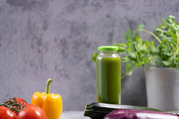 Organic and healthy green smoothie, Homemade healthy green vegetable juice with ingredients on...