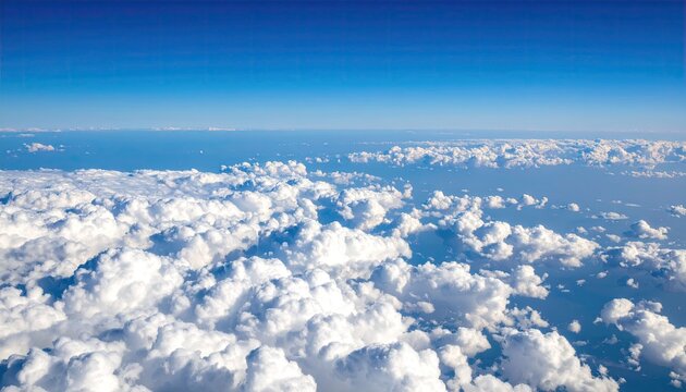High-altitude view of fluffy clouds and a clear sky