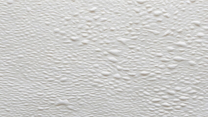 Obraz premium White Textured Surface with Water Droplets Close-Up Detail