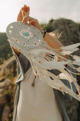 Close-up of female hands holding natural healing stones. Tools for energy balance, emotional...