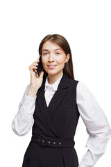 Confident businesswoman engaging in a phone conversation while wearing a stylish suit, exuding...