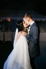 first dance of the bride and groom inside a restaurant