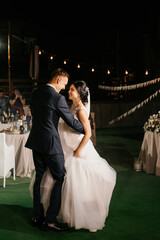 first dance of the bride and groom inside a restaurant