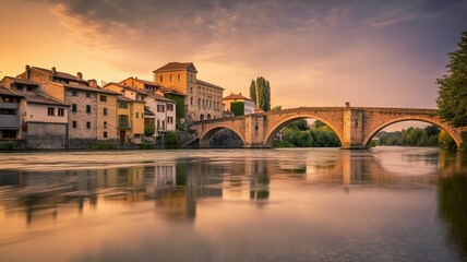 Obraz premium Reina. Moissac Bridge and Tarn River at Sunset, Tarn-et-Garonne, France