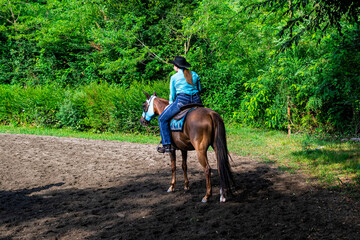 Cowgirl on horseback during an outdoor race
