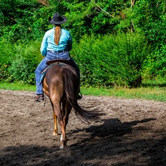 Cowgirl on horseback during an outdoor race