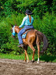 Cowgirl on horseback during an outdoor race
