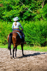 Cowgirl on horseback during an outdoor race
