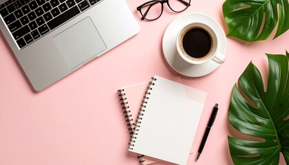 Flat lay photo of modern business tools like laptop, notebook, pen, glasses, and coffee cup arranged around empty space in the center, solid pastel background