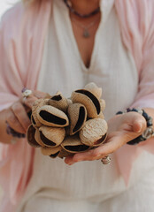 Close-up of female hands holding sound healing instruments. Tools for therapy, inner balance, and...