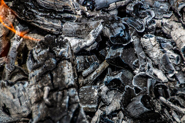 Lots of black coal close-up in a fire