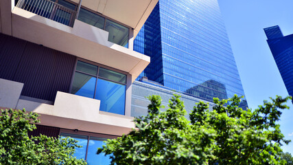City life, urban landscape and ecology.  Modern office complex with glass facades and smooth lines...