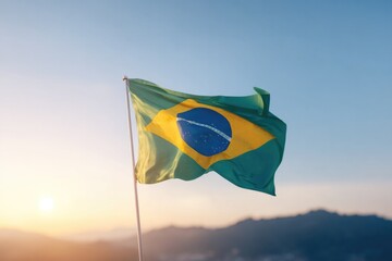 brazilian flag waving proudly with sunrise in background