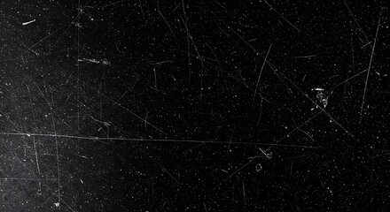 Distressed black surface with fine scratches and dust particles texture