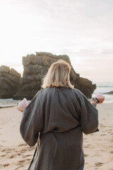 Close-up of female hands holding natural healing stones. Tools for energy balance, emotional...