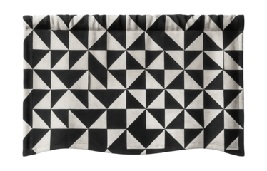 A bold geometric patterned valance in monochrome, fitting for a minimalist urban loft window.