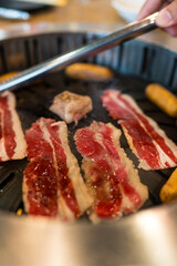 Japanese style bbq Yakiniku with beef sliced, charcoal fire in the stove