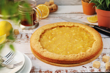 A tart with lemon marmalade served on the table