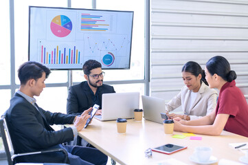 Business people group meeting with laptops in the modern office. Successful business professionals work together with colleagues while analytical report.