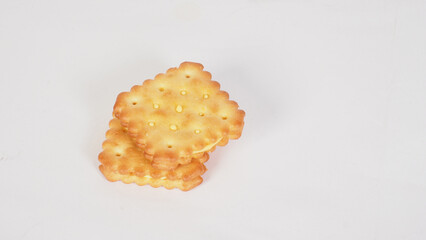 Cheese crackers with a golden brown color on white background