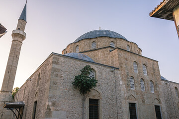 The Tekeli Mehmet Pasha Mosque is a classic example of Ottoman architecture. The mosque in the old town of Antalya. Domes of an ancient Turkish mosque and a minaret.