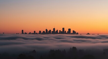 City skyline silhouettes rising above a sea of fog at sunrise