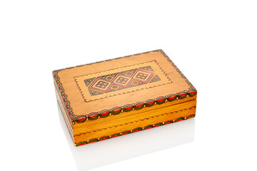 Wooden rare jewelry box isolated on white background, close-up.