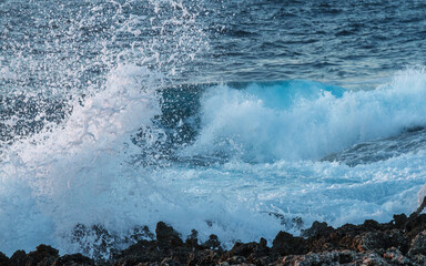 waves crashing on rocks