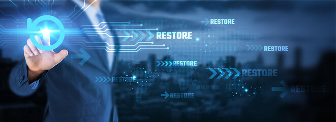 Hand interacts with glowing 'Restore' icon, symbolizing data recovery or system renewal. Digital...